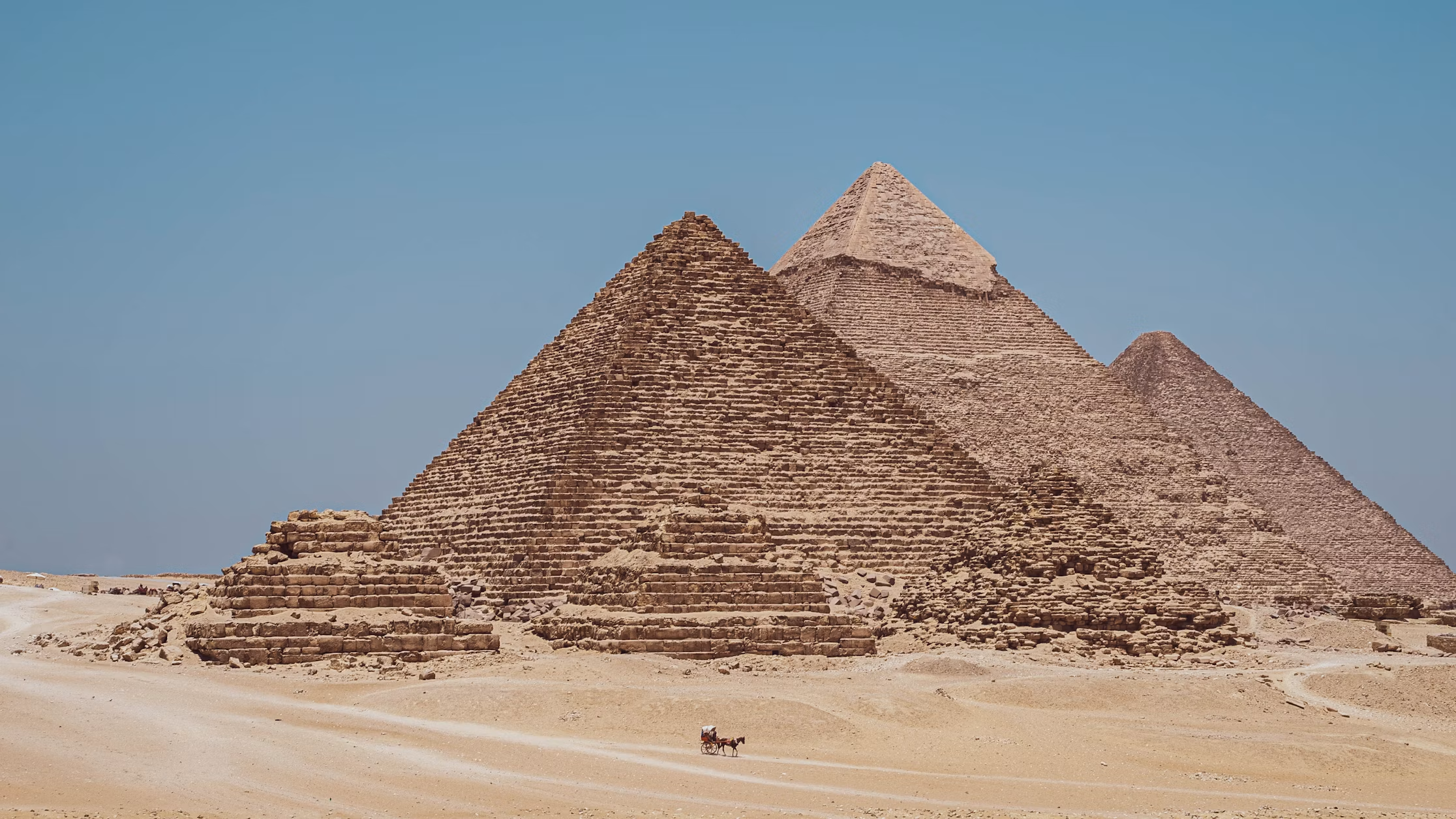 Pyramids of Giza under a clear blue sky